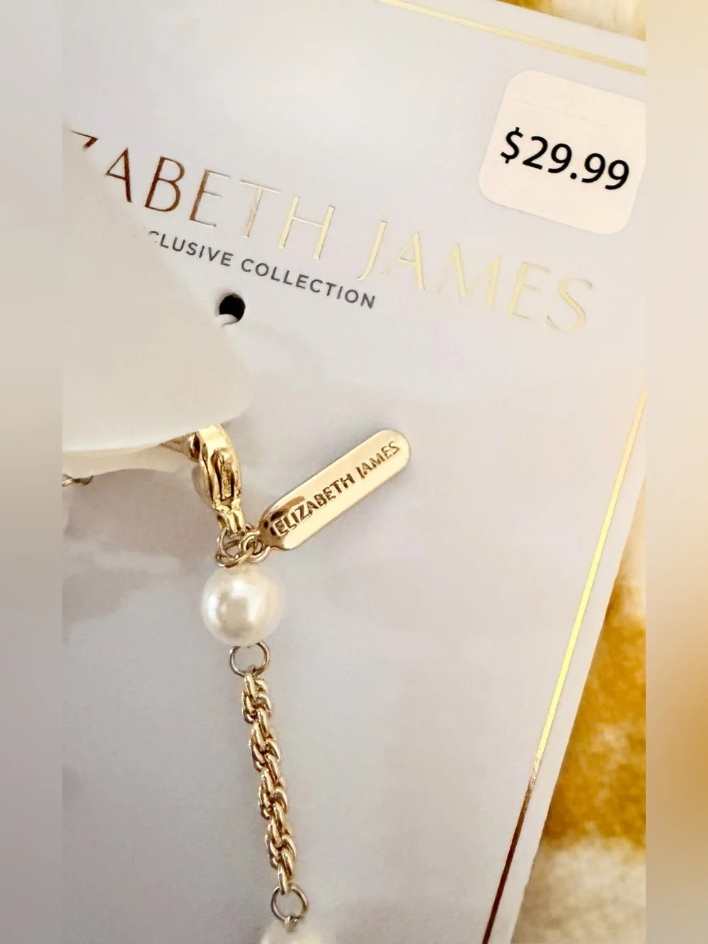 NWT Elizabeth and James Gold and White Beaded Phone Charm Strap w. Bow Detail